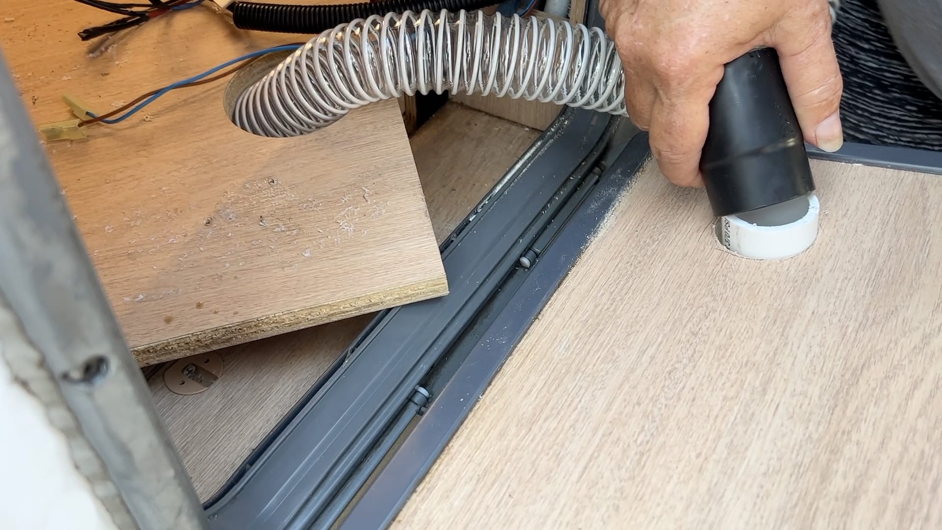 Attaching Hose to Hole in Side of the Van